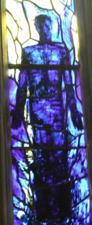 Stained glass depiction of Jesus in Gloucester Cathedral