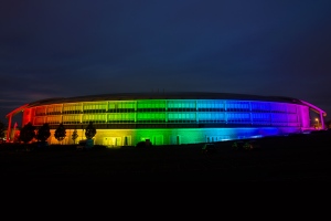 Doughnut building enveloped in rainbow lights copyright GCHQ, used with permission